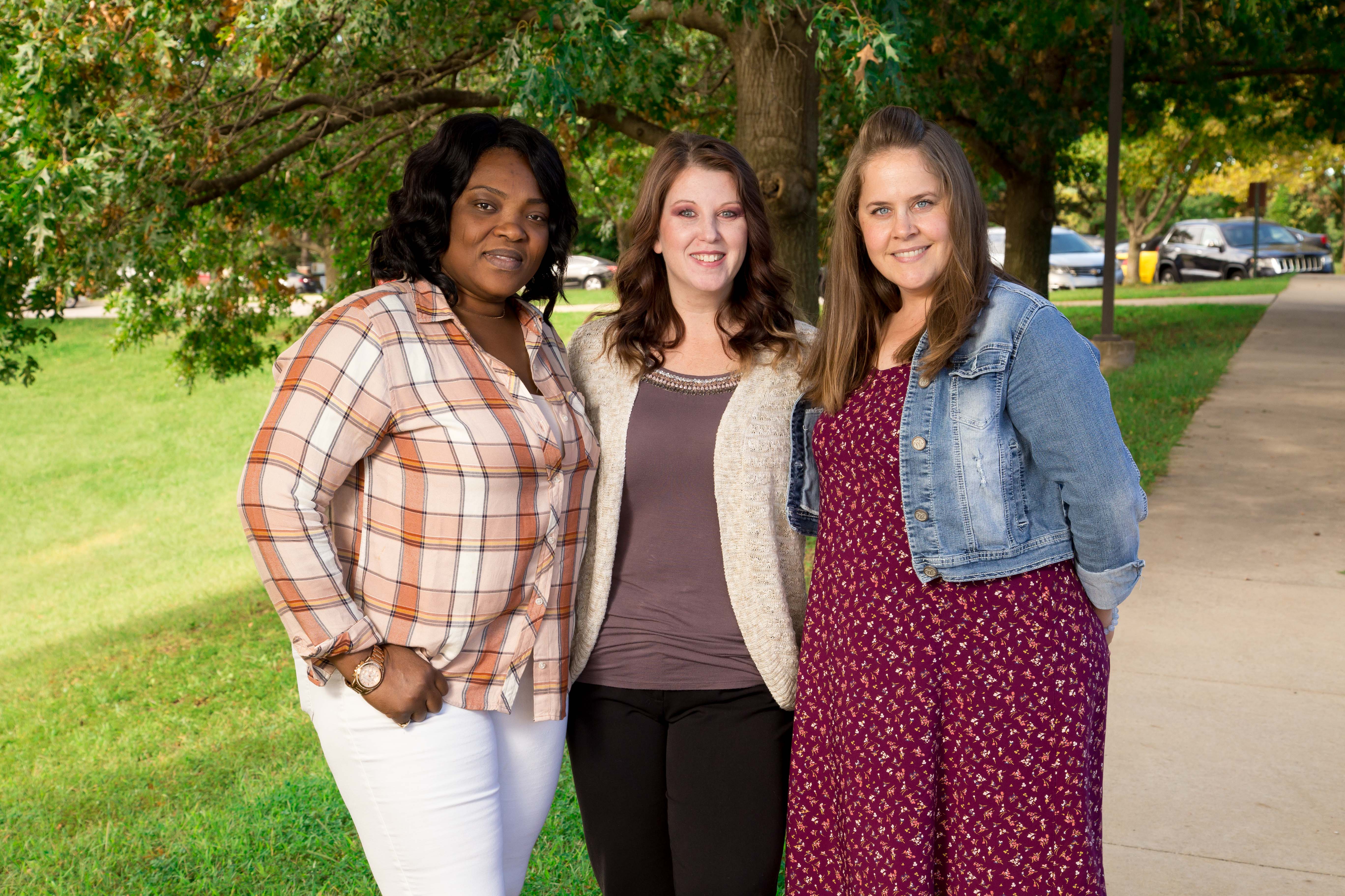 Barton Community College students (from left) Annick Adjovi-Segning, Rebecca Grindle and Susie Thorne pose for a photo outside Barton’s Fort Leavenworth campus.