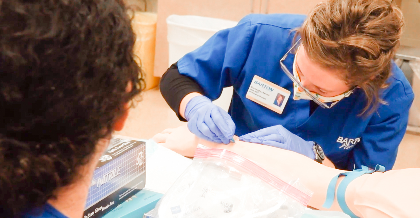 nurse practicing putting in an IV