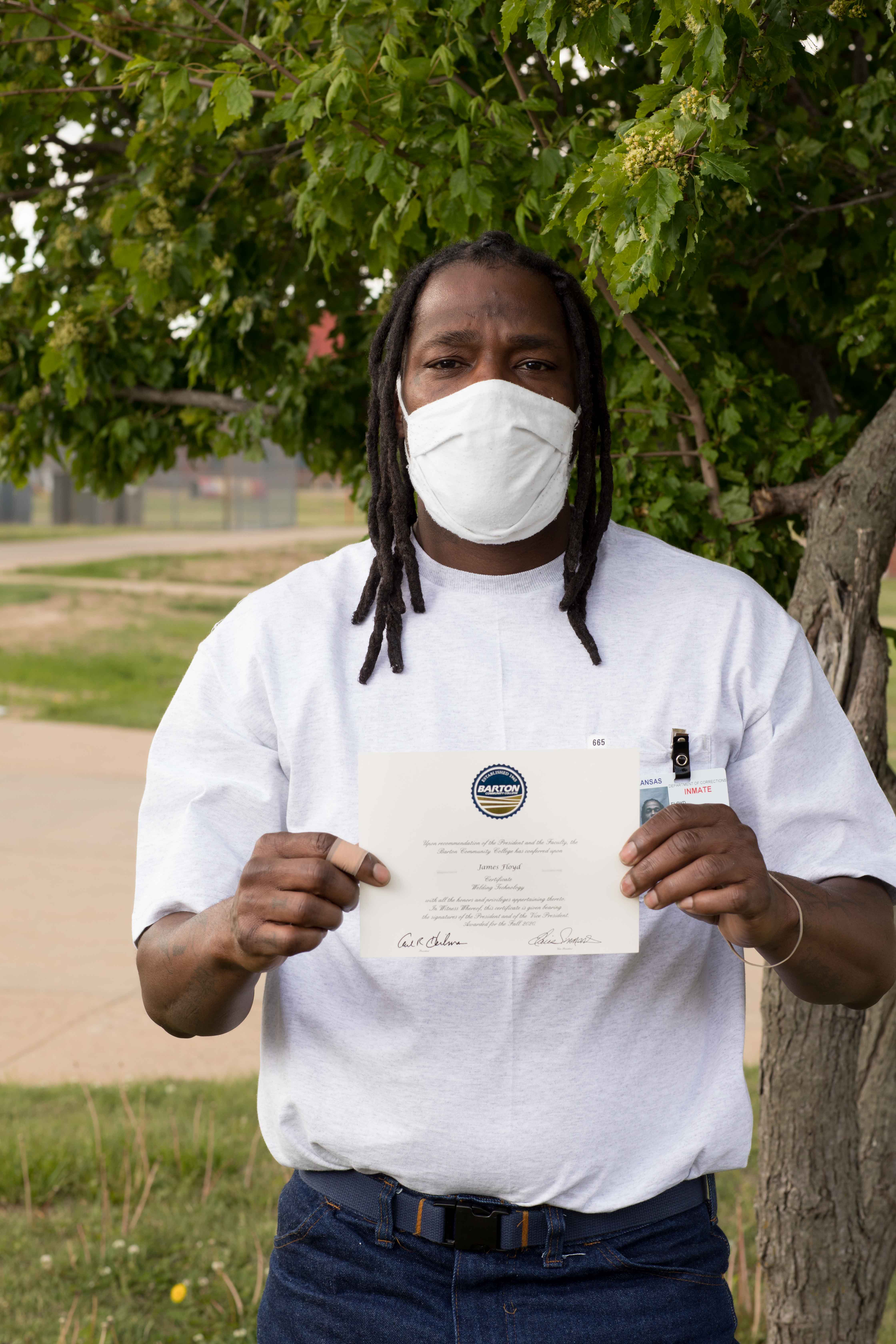 James Floyd poses with his certificate at Ellsworth Correctional Facility.