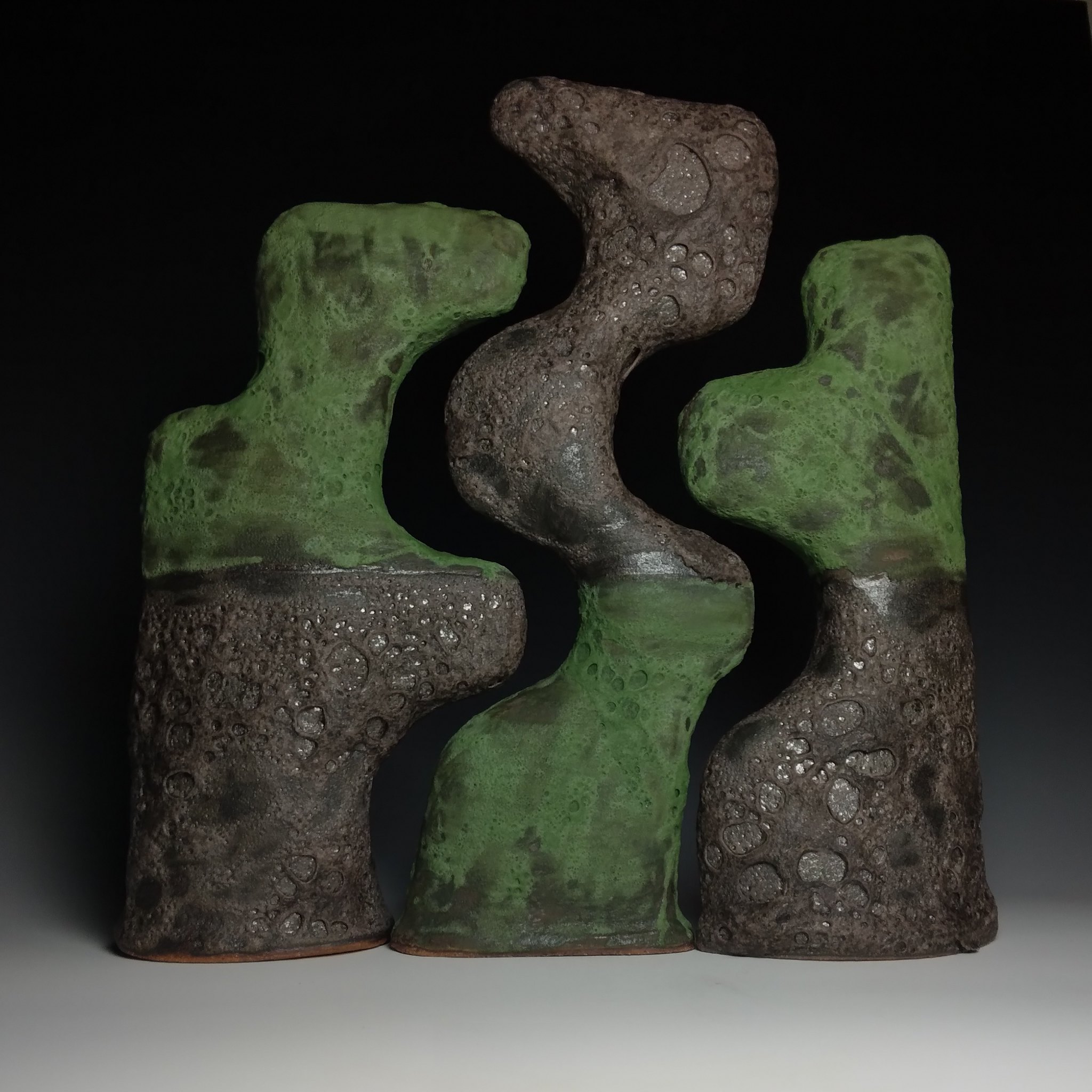 brown and green abstract sculpture
