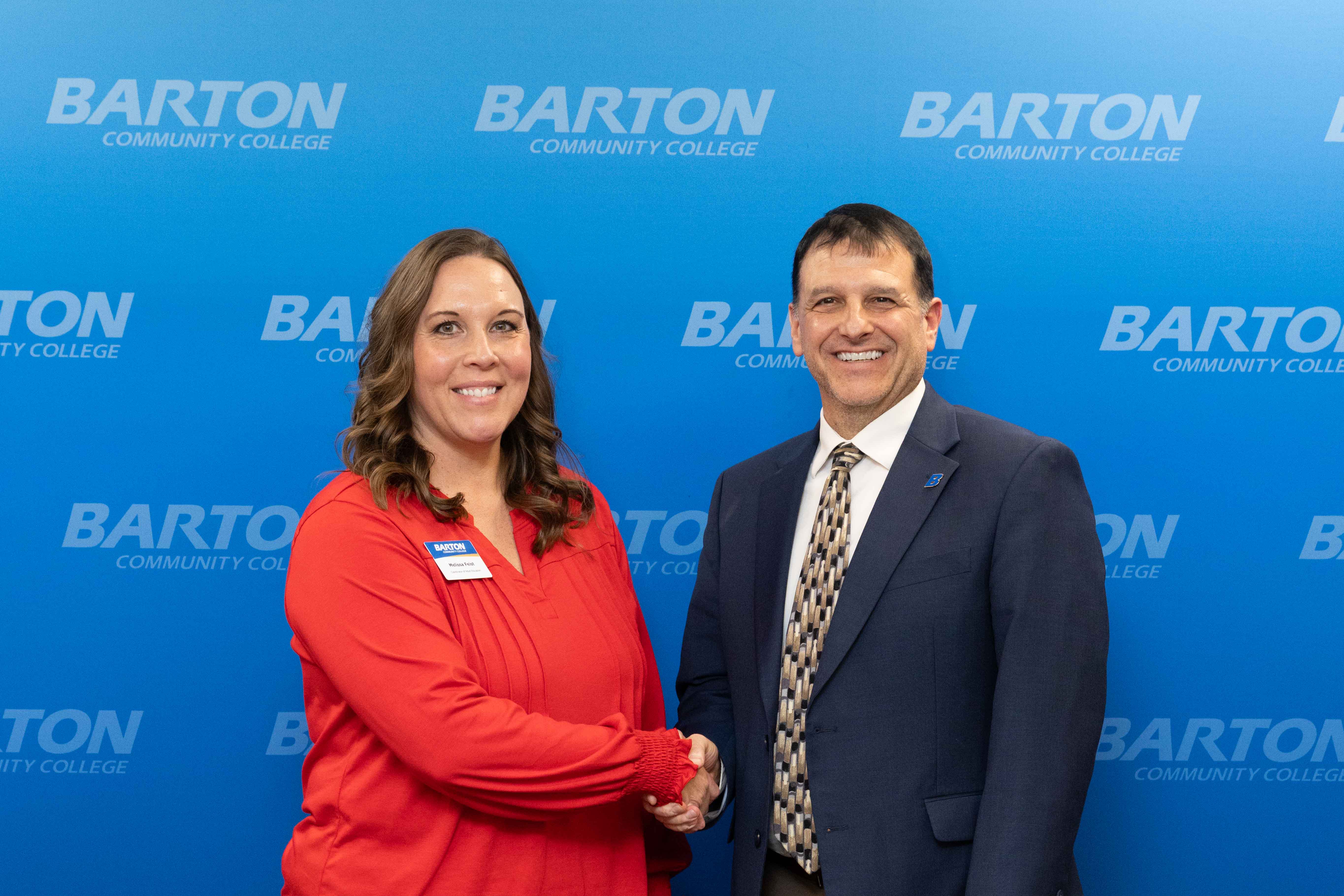 woman and man shaking hands