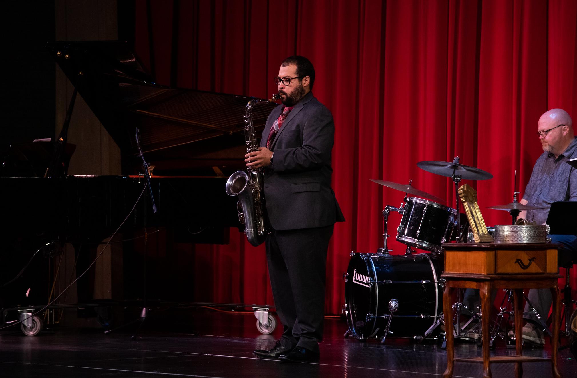 dr. luis palacios plays a saxophone at a previous concert