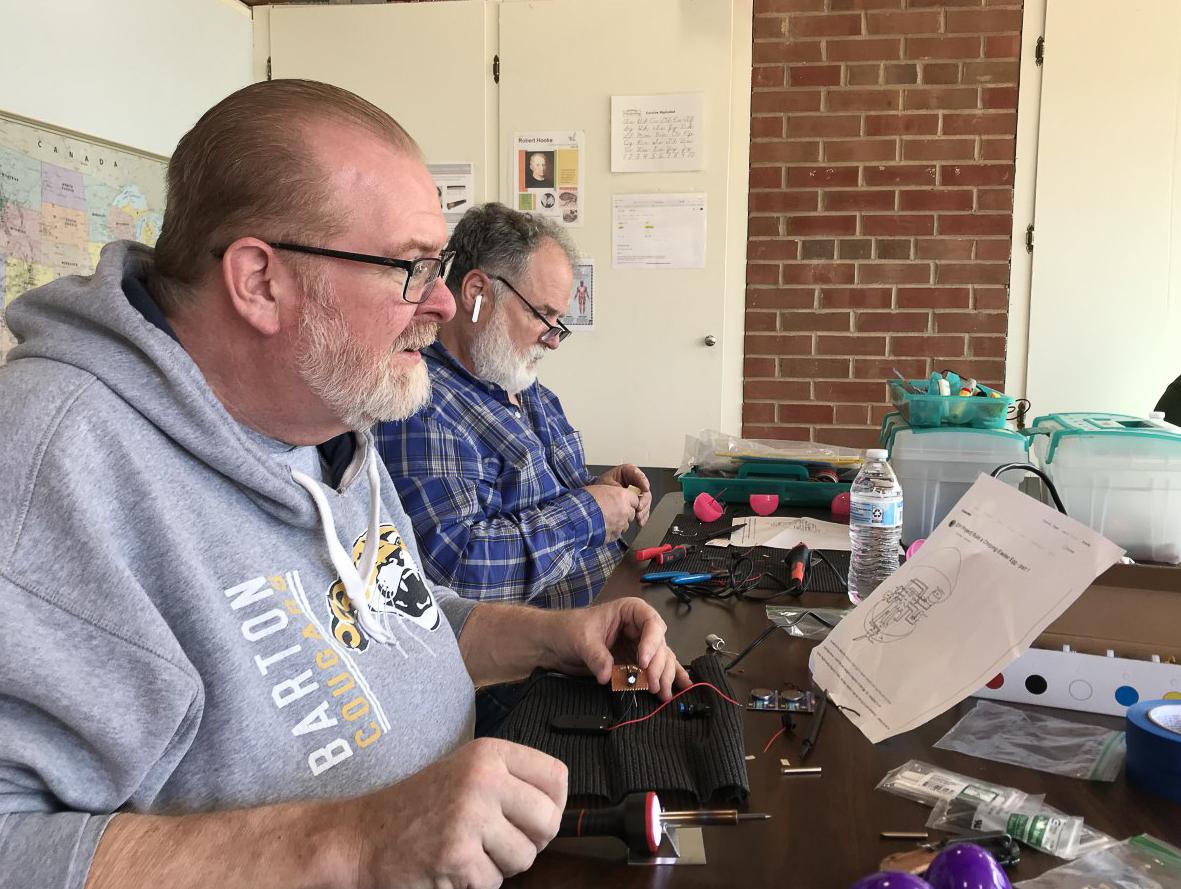 people building electronic plastic eggs