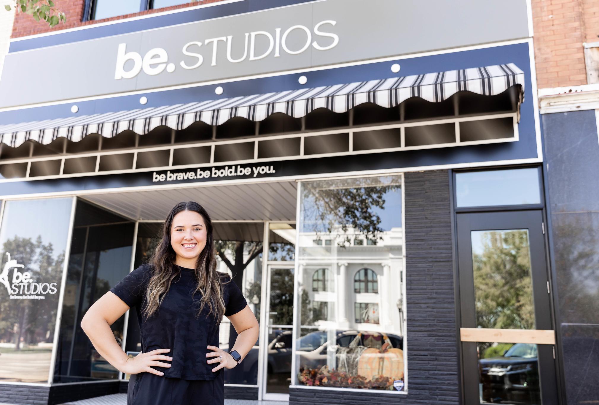 woman standing in front of her dance studio