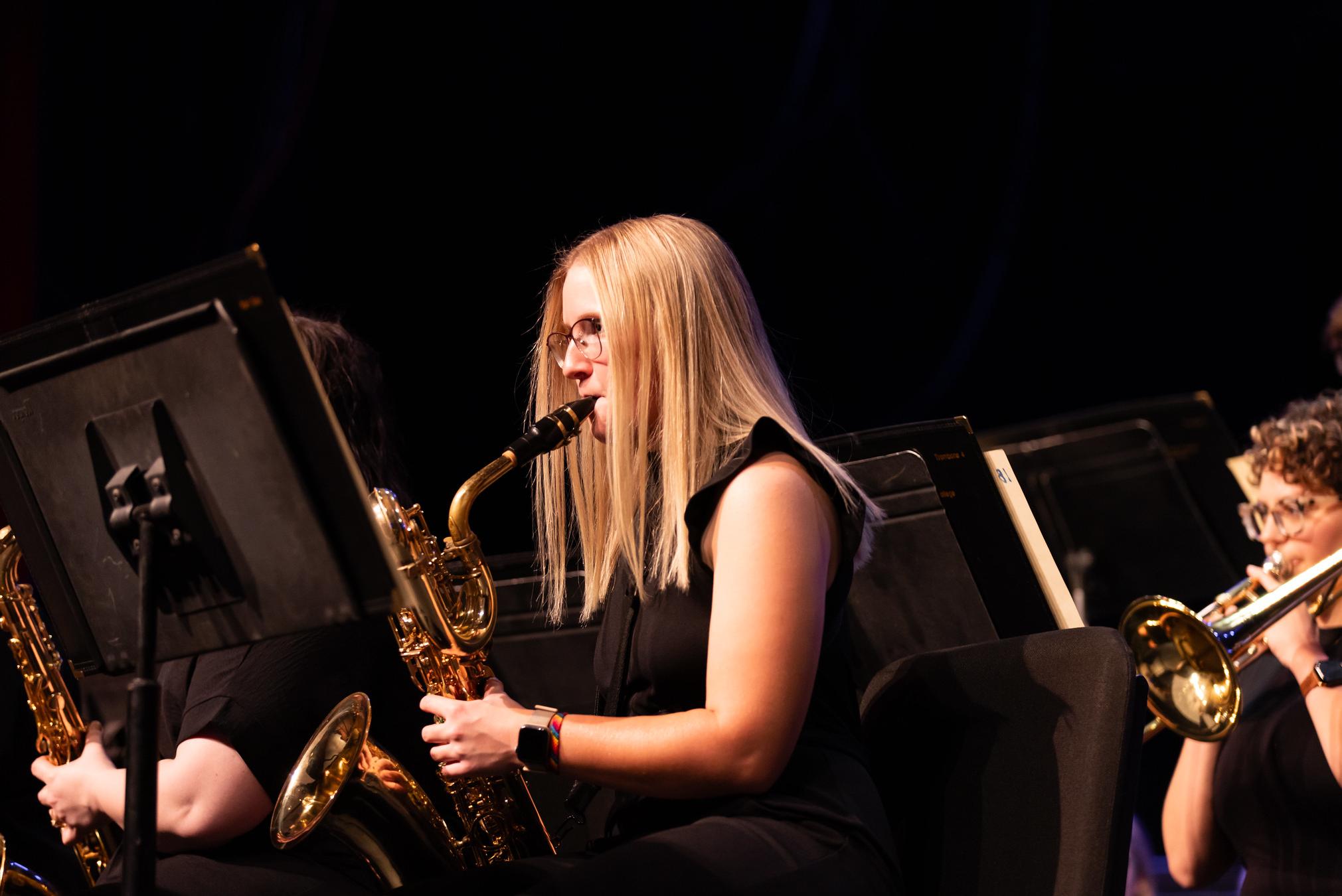 woman playing a saxophone 