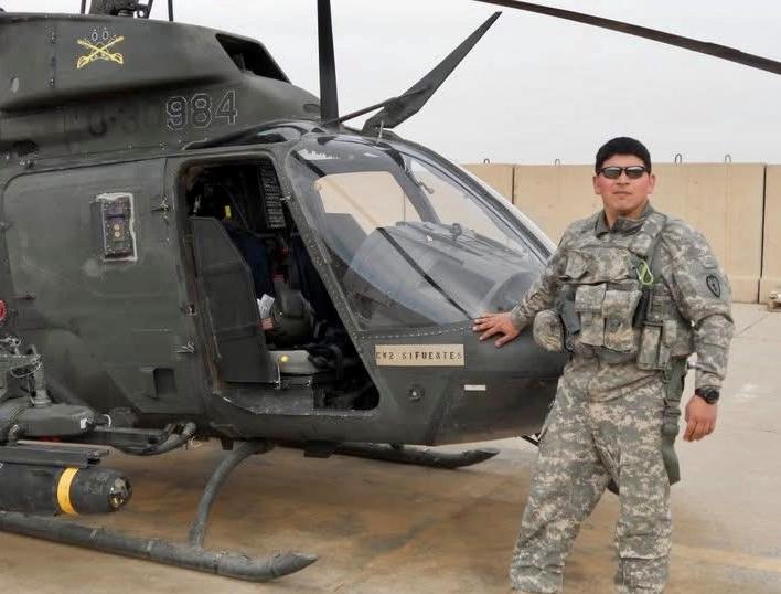 man standing by helicopter