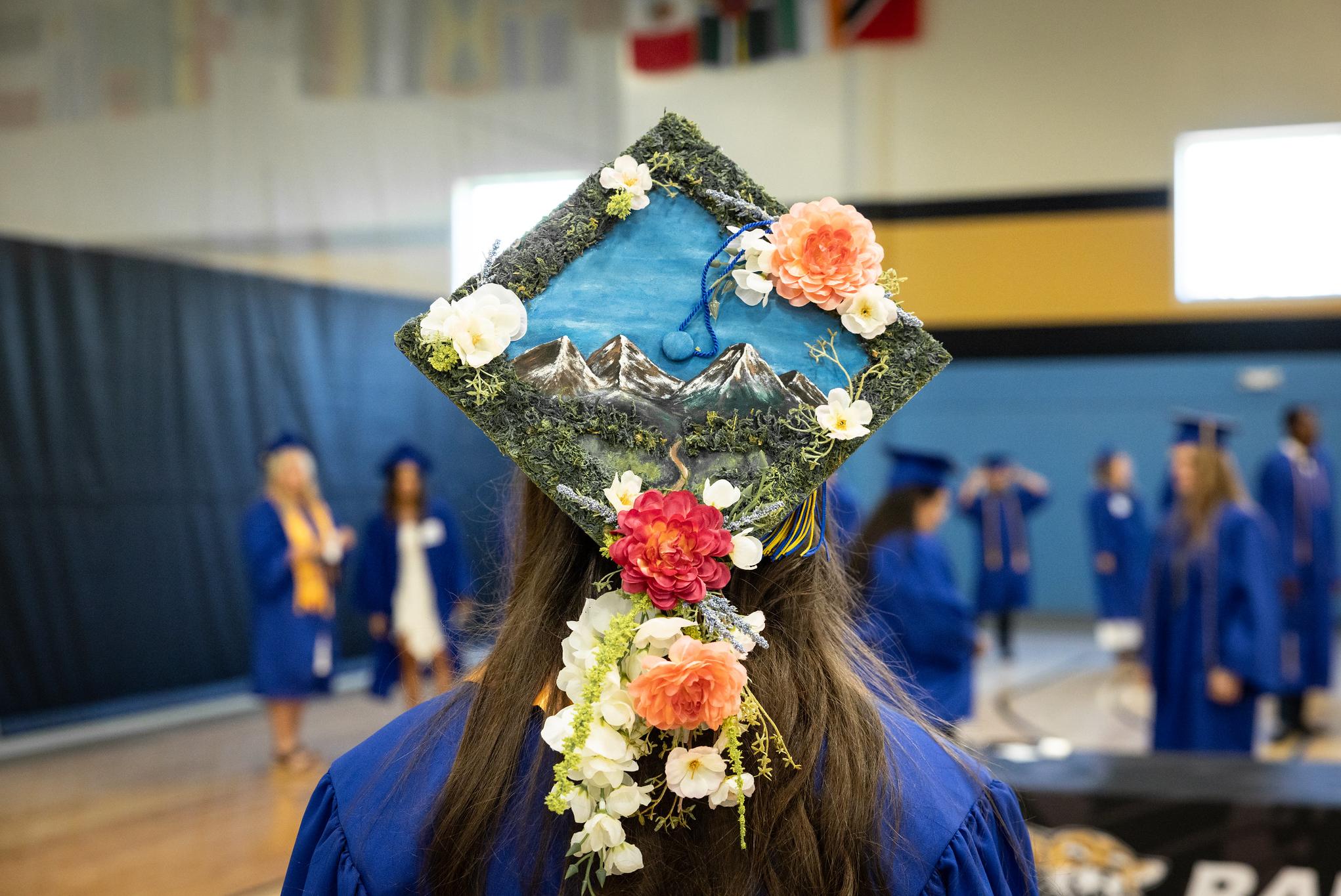 person in grad cap facing away from camera