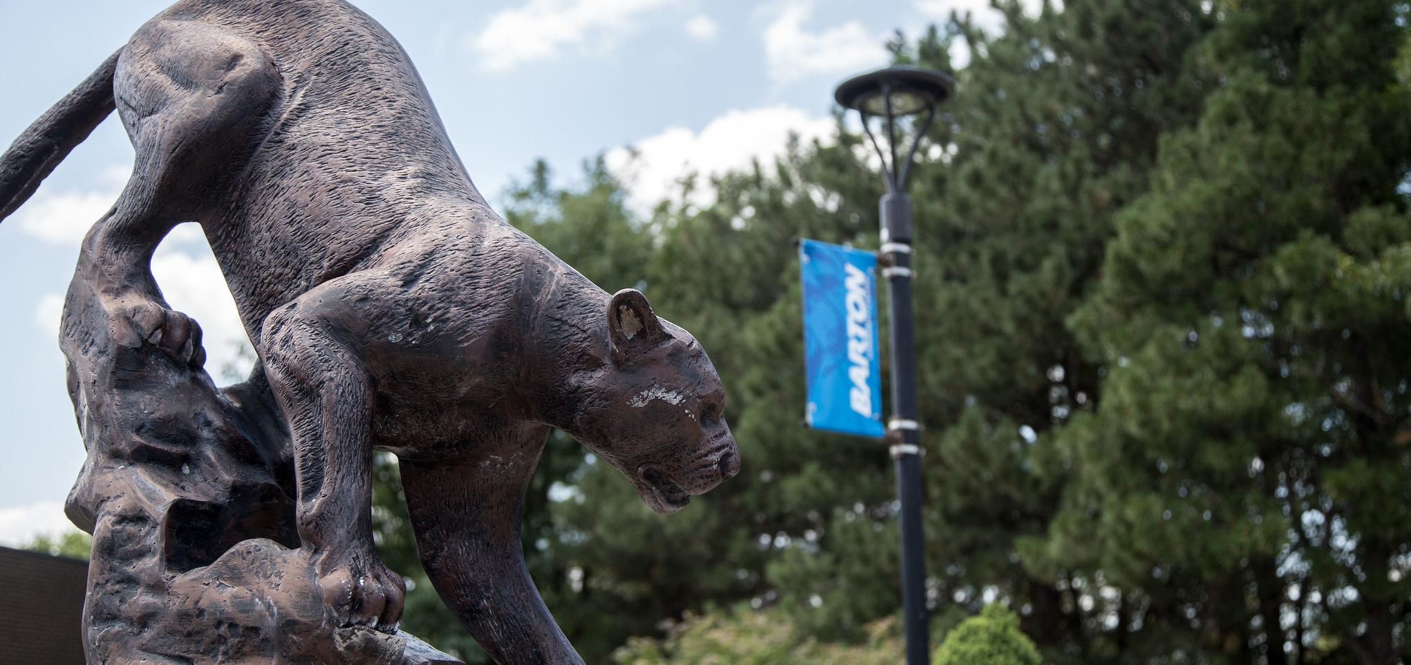 statue of a cougar on campus