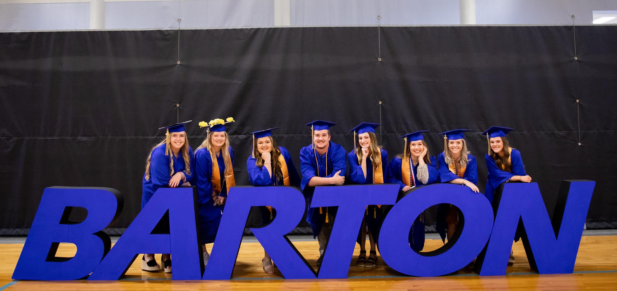 Graduates pose after commencement ceremony