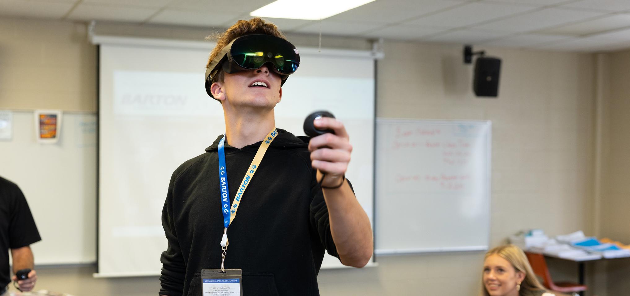 Student interacts with technology visor at JKSD