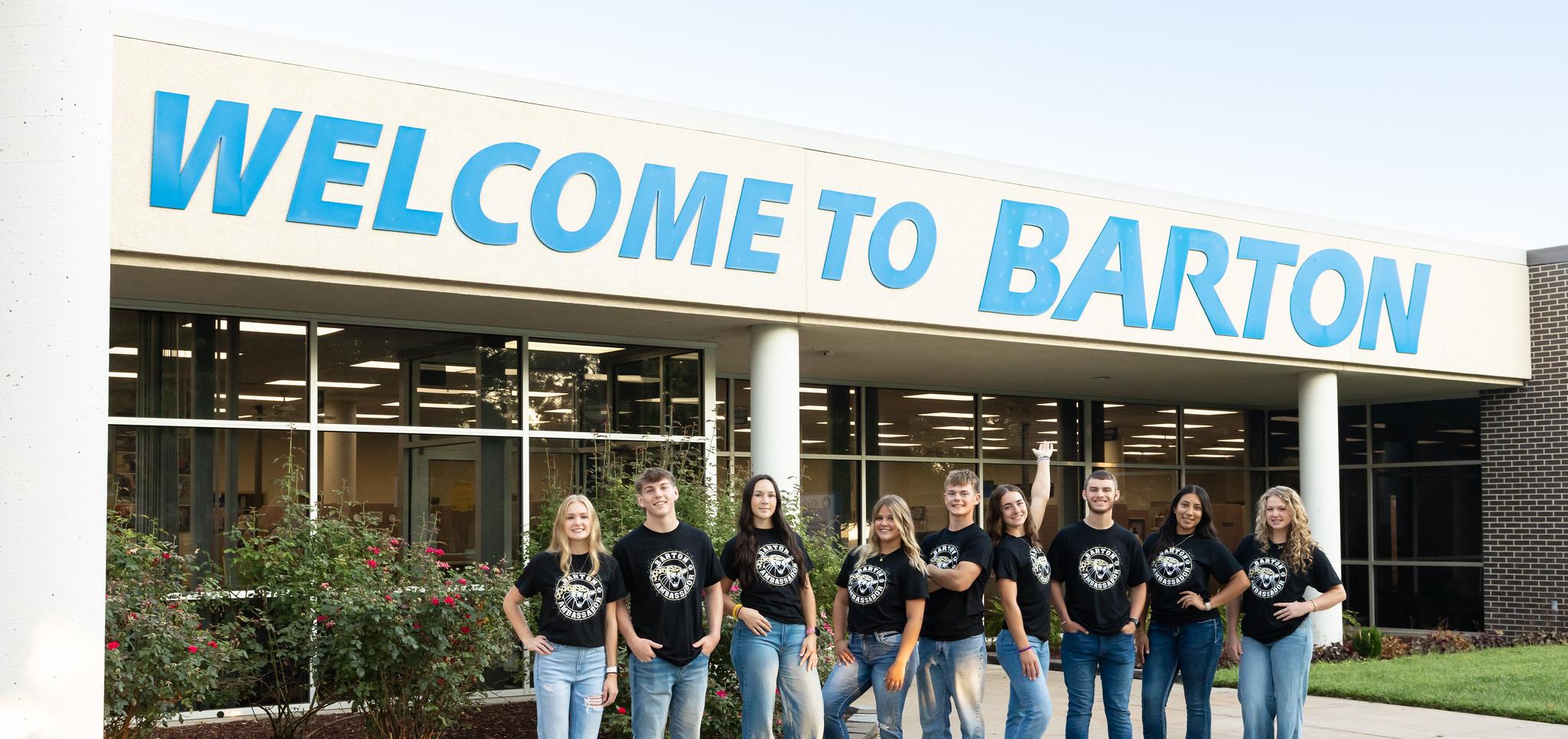 Barton Ambassadors 2025 in front of Welcome to Barton signage